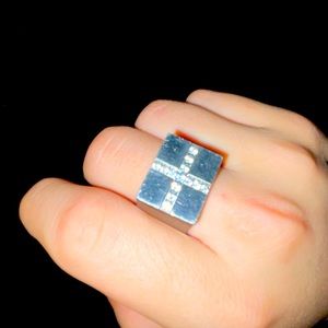 It’s A Stainless Steel CH ring with real lab made diamonds!